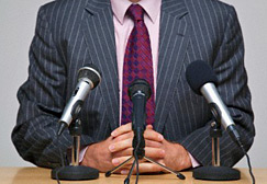 Man in front of microphones
